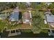 Aerial view of home situated on a waterfront lot with a dock at 4638 Heavens Way, New Port Richey, FL 34652