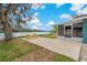 The home features a spacious backyard with lake views and a picnic table at 4638 Heavens Way, New Port Richey, FL 34652