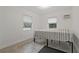 Bright bedroom with tile floors and two windows at 4638 Heavens Way, New Port Richey, FL 34652