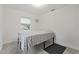 Bedroom features tiled floors, window, and wall AC unit at 4638 Heavens Way, New Port Richey, FL 34652
