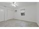 Bedroom featuring tile flooring, closet, and window at 4638 Heavens Way, New Port Richey, FL 34652