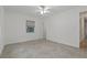 Bedroom with tile floors, a ceiling fan, and window at 4638 Heavens Way, New Port Richey, FL 34652