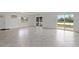 Bright living room featuring tile floors, a water view, and sliding glass doors at 4638 Heavens Way, New Port Richey, FL 34652