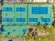Aerial view of community tennis and basketball courts in a well maintained community at 4842 Coquina Key Se Dr # B, St Petersburg, FL 33705