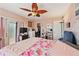 Bedroom featuring balcony access, walk in closet and dresser at 4842 Coquina Key Se Dr # B, St Petersburg, FL 33705