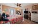 Bedroom with balcony access, desk, and mounted TV at 4842 Coquina Key Se Dr # B, St Petersburg, FL 33705