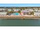 Stunning waterfront building with a pool and boat dock offering scenic views and resort-style amenities at 4842 Coquina Key Se Dr # B, St Petersburg, FL 33705
