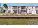 Waterfront property featuring private patios, outdoor stairways, and scenic views, perfect for coastal living at 4842 Coquina Key Se Dr # B, St Petersburg, FL 33705
