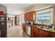 Kitchen with wood cabinets, stainless steel appliances, double sink, and window with water view at 4842 Coquina Key Se Dr # B, St Petersburg, FL 33705