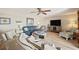 Cozy living room featuring wood floors, a ceiling fan, and comfortable seating at 4842 Coquina Key Se Dr # B, St Petersburg, FL 33705