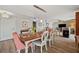 Open concept living room and dining room with bright lighting and wood floors at 4842 Coquina Key Se Dr # B, St Petersburg, FL 33705