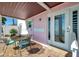 Charming outdoor patio with a dining table and views of the water, perfect for al fresco dining at 4842 Coquina Key Se Dr # B, St Petersburg, FL 33705
