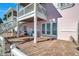 Outdoor patio with chairs, brick flooring and ocean views at 4842 Coquina Key Se Dr # B, St Petersburg, FL 33705