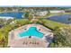Inviting swimming pool surrounded by brick patio and lounge chairs, ideal for relaxation and outdoor fun at 4842 Coquina Key Se Dr # B, St Petersburg, FL 33705