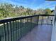 Cozy tiled balcony with black metal railings, perfect for enjoying the outdoors at 5400 Park N St # 214, St Petersburg, FL 33709