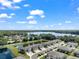 Breathtaking aerial view of a residential area with lakes and houses at 5994 Shiner St, Land O Lakes, FL 34638