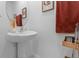 Modern bathroom sink with a round mirror and sleek faucet, complemented by decor at 5994 Shiner St, Land O Lakes, FL 34638