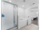 Modern bathroom featuring a glass-enclosed shower, soaking tub, and tiled surround at 5994 Shiner St, Land O Lakes, FL 34638