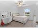 Bedroom with vanity, chair, neutral carpet and walls, and natural light through the window at 5994 Shiner St, Land O Lakes, FL 34638