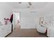 Bedroom with neutral carpet, LED lighting, vanity, closet, and natural light through the windows at 5994 Shiner St, Land O Lakes, FL 34638