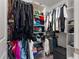Walk-in closet with ample shelving and rods, perfect for organization and storage of your attire at 5994 Shiner St, Land O Lakes, FL 34638
