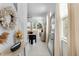 Welcoming entryway featuring a mirror and a view into the living area at 5994 Shiner St, Land O Lakes, FL 34638