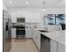 This modern kitchen features stainless steel appliances and sleek countertops, creating an efficient cooking space at 5994 Shiner St, Land O Lakes, FL 34638