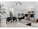 Spacious living area with tile floors, a staircase, and a view into the kitchen at 5994 Shiner St, Land O Lakes, FL 34638
