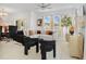 Bright living room with large windows, modern furnishings, and neutral tones at 5994 Shiner St, Land O Lakes, FL 34638