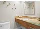 Half-bath with a unique marble counter, modern fixtures, and decorative art at 611 Brightwaters Ne Blvd, St Petersburg, FL 33704