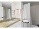 Bathroom with vanity featuring granite countertop and a shower with curtain at 611 Brightwaters Ne Blvd, St Petersburg, FL 33704