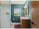 Modern bathroom with stylish vanity, granite countertop, and a walk-in shower at 611 Brightwaters Ne Blvd, St Petersburg, FL 33704