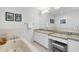 Bathroom featuring a soaking tub, vanity, and granite countertops at 611 Brightwaters Ne Blvd, St Petersburg, FL 33704