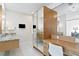 Bathroom boasts a modern vanity, mirrored closet, and a bright, clean design at 611 Brightwaters Ne Blvd, St Petersburg, FL 33704