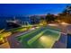 Hot tub at dusk overlooking waterfront views of the city skyline in the distance at 611 Brightwaters Ne Blvd, St Petersburg, FL 33704