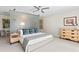 Tastefully decorated bedroom features a bed, dresser, and abstract art on the wall at 611 Brightwaters Ne Blvd, St Petersburg, FL 33704