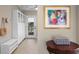 Bright mud room featuring white cabinets, a bench, and a view of the outdoors at 611 Brightwaters Ne Blvd, St Petersburg, FL 33704