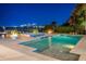 A beautiful backyard pool and spa overlook a bay with city skyline views at 611 Brightwaters Ne Blvd, St Petersburg, FL 33704