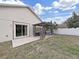 Backyard with a charming pergola, a patio and a lush green lawn, creating an outdoor space at 6512 N 24Th St, Tampa, FL 33610