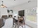 Bright dining area with a view and adjacent to the cozy living room at 6512 N 24Th St, Tampa, FL 33610