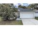 Charming single-Gathering home with a well-maintained lawn and two car garage at 6512 N 24Th St, Tampa, FL 33610