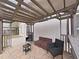 Outdoor patio featuring a pergola, stone flooring and stylish furniture for relaxation at 6512 N 24Th St, Tampa, FL 33610