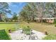 Backyard patio area features comfortable seating, ideal for relaxation and enjoying the outdoors at 8233 Danubian Pl, Trinity, FL 34655