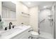 Bright bathroom features a walk-in shower, modern vanity, and contemporary fixtures at 9525 Blind Pass Rd # 301, St Pete Beach, FL 33706