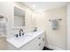 Spacious bathroom with double sinks, modern fixtures, and ample storage at 9525 Blind Pass Rd # 301, St Pete Beach, FL 33706