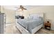 Cozy bedroom featuring a ceiling fan, and a dedicated desk for work or study at 9525 Blind Pass Rd # 301, St Pete Beach, FL 33706