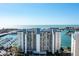 Expansive view of waterfront condo building with marina, ocean and harbor at 9525 Blind Pass Rd # 301, St Pete Beach, FL 33706