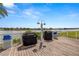 Convenient community grilling area with barbecue stations and waterfront scenery at 9525 Blind Pass Rd # 301, St Pete Beach, FL 33706