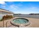 Relaxing round hot tub overlooking serene water views and lush landscaping at 9525 Blind Pass Rd # 301, St Pete Beach, FL 33706