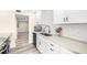 Bright kitchen featuring stainless steel sink, ample counter space, and sleek cabinetry at 9525 Blind Pass Rd # 301, St Pete Beach, FL 33706